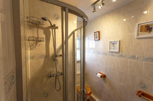 a bathroom with a shower with a glass door at The Hay Loft in Sedgefield