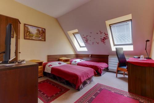 Ein Bett oder Betten in einem Zimmer der Unterkunft Penzión Grand