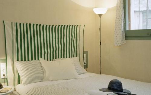 Ένα ή περισσότερα κρεβάτια σε δωμάτιο στο Apartamentos Saltarel·lo