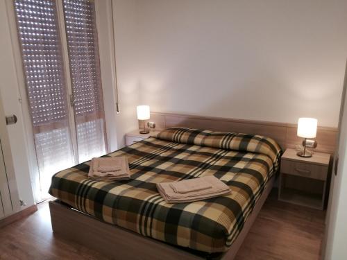 Säng eller sängar i ett rum på House Degli Angeli Rooms