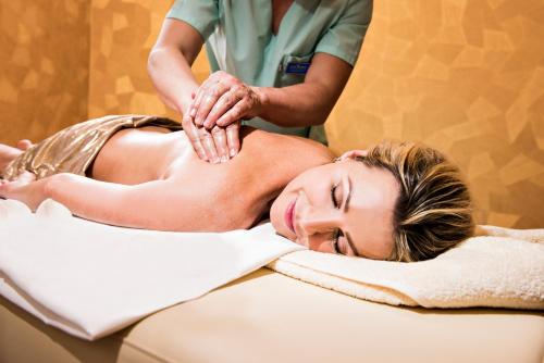a woman getting a massage at a spa at Royal Palace in Turčianske Teplice