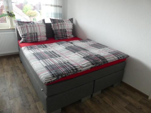 מיטה או מיטות בחדר ב-Ferienwohnung Anke - Appartement 5b