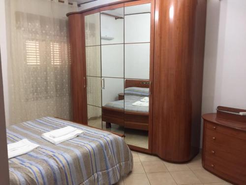 A bed or beds in a room at Sacca House