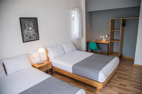 Postel nebo postele na pokoji v ubytování Hostal Tres Central