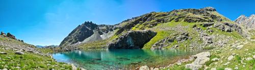 a mountain lake in the middle of a canyon at Hotel Garni Central - Zimmer - Studios - Apartments in Kappl