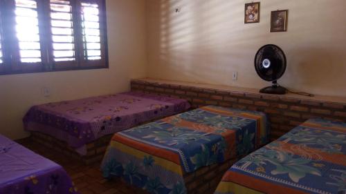 Кровать или кровати в номере casa na praia de guajiru