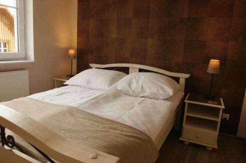 Кровать или кровати в номере Apartament Jedynka Villa Incognito
