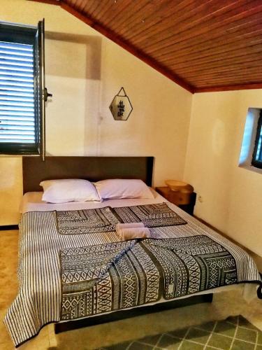 Una cama o camas en una habitación de Vojinovic Apartments