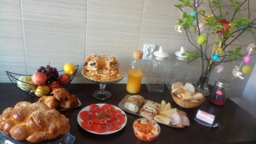 a table with a bunch of different types of food at Folwark Anna in Kamienica Polska