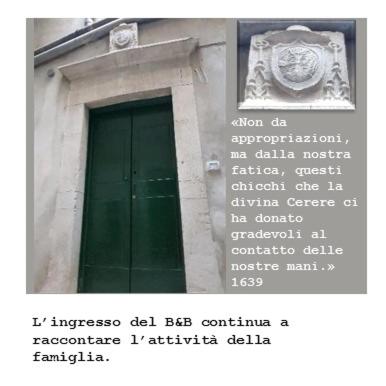 a sign on the side of a building with a window at Domus Arsia in Irsina