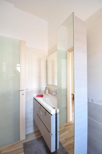 a bathroom with a sink and a mirror at Uptoyou in Milan