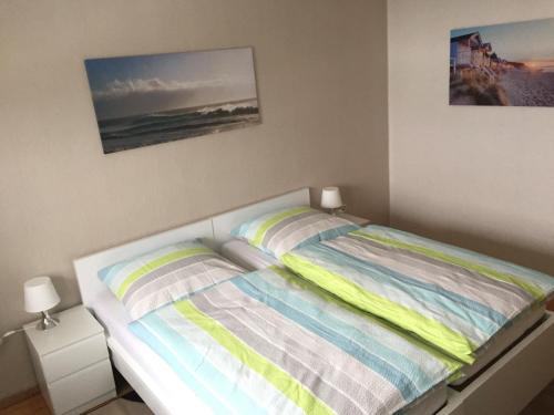 a bedroom with a bed with two pillows on it at Haus Bergzauber in Eschlkam