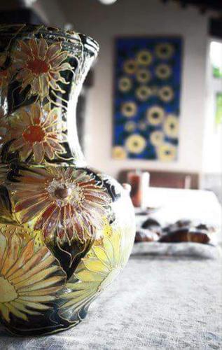 a vase with flowers on it sitting on a table at B&B Villa Floriana in Tortoreto Lido