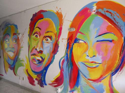 a painting of people on a wall at Hostel Hospedarte Chapultepec in Guadalajara