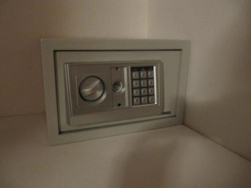 a microwave oven on the wall in a room at Coco Beach Home in Coco