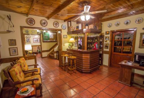 a large room with a bar in a house at Hosteria Sirenuse in Mar del Plata