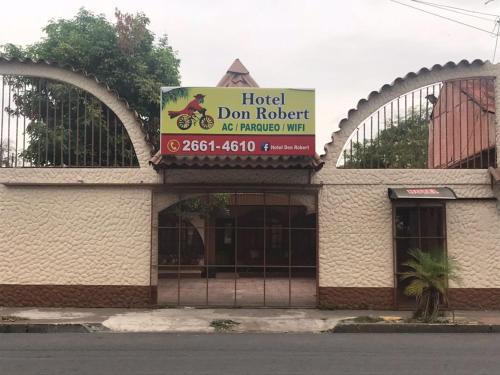 a building with a sign that reads hotel dont reject no franchisemitemite at Hotel Don Robert in Puntarenas