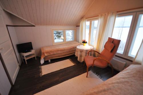 A bed or beds in a room at Villa Haapaniemi