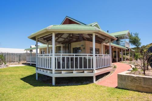 a large house with a gazebo on a lawn at The Southouse Beachouse in Gnarabup