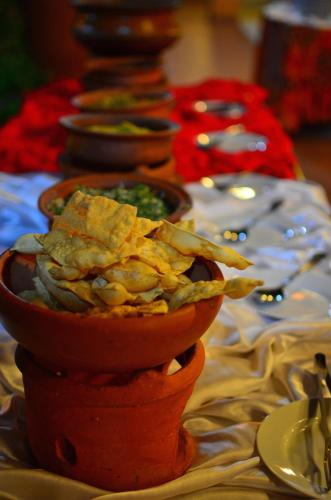 a group of bowls of food on a table at Eva Lanka Hotel - Beach & Wellness in Tangalle