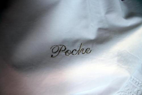 a close up of the word pacific on a white dress at Maison Poche in Caupenne-dʼArmagnac