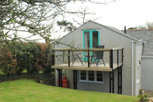 a deck on the side of a house at The Dartmoor Linhay in Yelverton