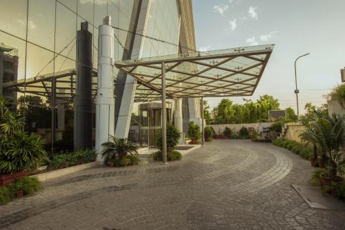 an empty street with a building with a metal canopy at Shakun Hotels And Resorts in Jaipur