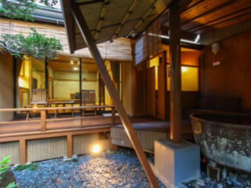 an outside view of a house with a patio at Grandia Housen in Awara