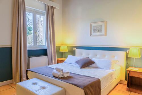 Postel nebo postele na pokoji v ubytování Hotel Ponte di Rialto