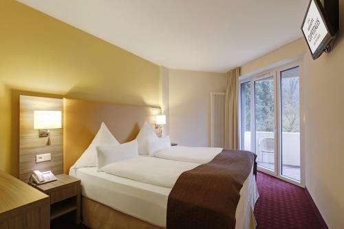 Letto o letti in una camera di Parkhotel CUP VITALIS