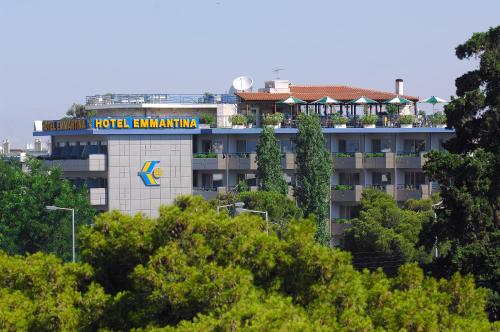 a large building with a blue sky at Emmantina Hotel in Athens