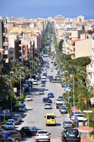 a busy city street filled with cars and buildings at B&B MaryJosè in Trapani