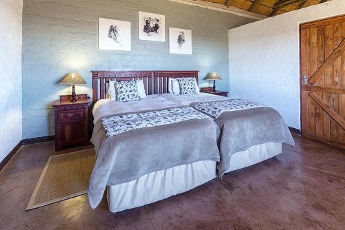 Ліжко або ліжка в номері Grootberg Lodge