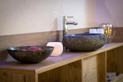 a bathroom with a sink and a bowl on a counter at Apart Zwingerhof in Ladis