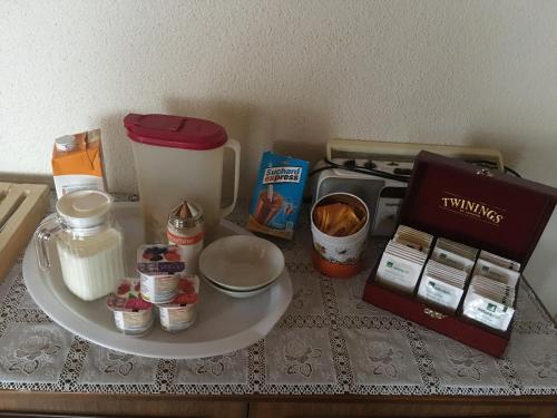 a counter topped with a counter top with food and a microwave at Privatzimmer / bed & breakfast in Andermatt