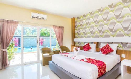 Postel nebo postele na pokoji v ubytování Phi Phi Maiyada Resort