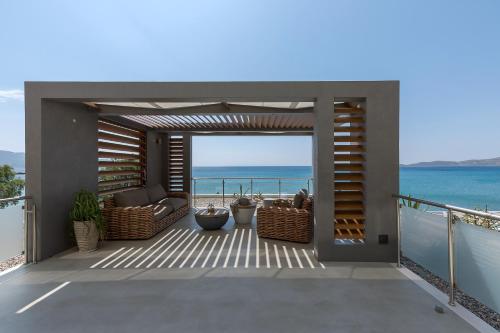 a balcony with a view of the ocean at Anastasia Hotel & Suites Mediterranean Comfort in Karistos