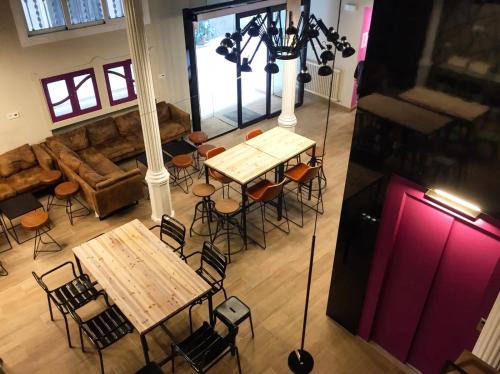 an overhead view of a restaurant with tables and chairs at Safestay Barcelona Gothic in Barcelona