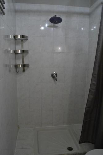 a bathroom with a shower with a toilet and a sink at Casa Messi in Pitigliano