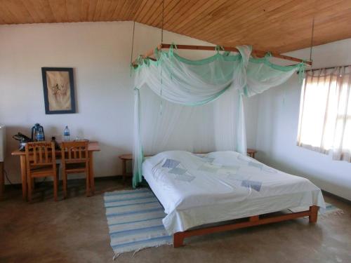 Ένα ή περισσότερα κρεβάτια σε δωμάτιο στο Matema Lake Shore Resort