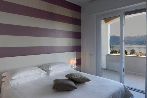 Residence Le Primule tesisinde bir odada yatak veya yataklar