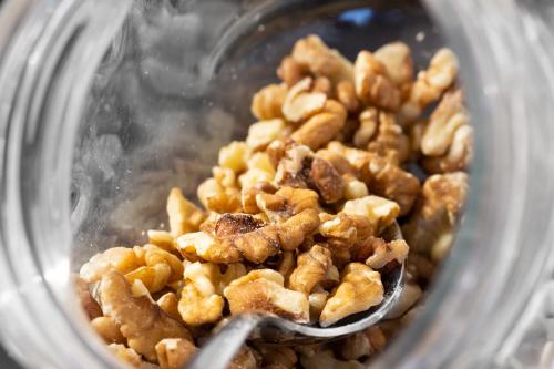 a pile of nuts in a bowl with a spoon at Il Convento Dei Fiori Di Seta in Bologna