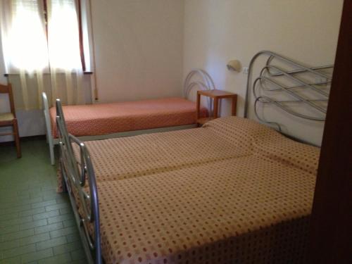 Posteľ alebo postele v izbe v ubytovaní Residence Pecci