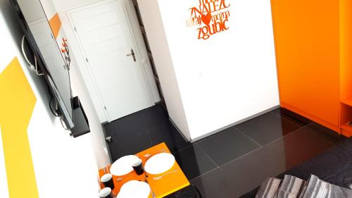 a room with a refrigerator and a table with stuffed animals at Walk distance to mokotow business park in Warsaw
