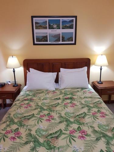 Postel nebo postele na pokoji v ubytování Piarco Village Suites