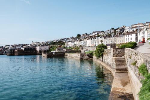 a view of a river in a city with buildings at Greenbank Hotel in Falmouth