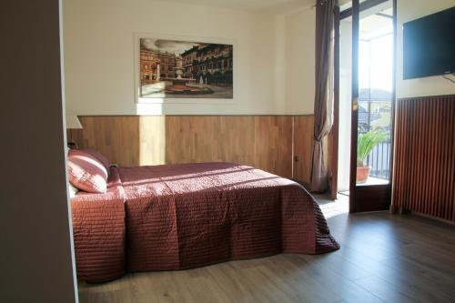 A bed or beds in a room at Palazzo Cinque Greenview