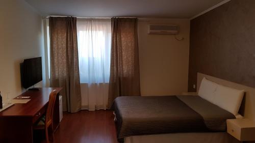 Posteľ alebo postele v izbe v ubytovaní Hotel Mic