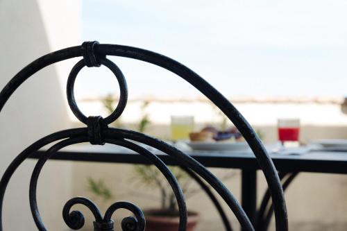 a close up of the back of a black chair at Il Castellaro in Borghi