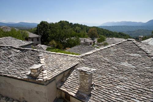 an overhead view of roofs of a village at Hotel Monodendri in Monodendri